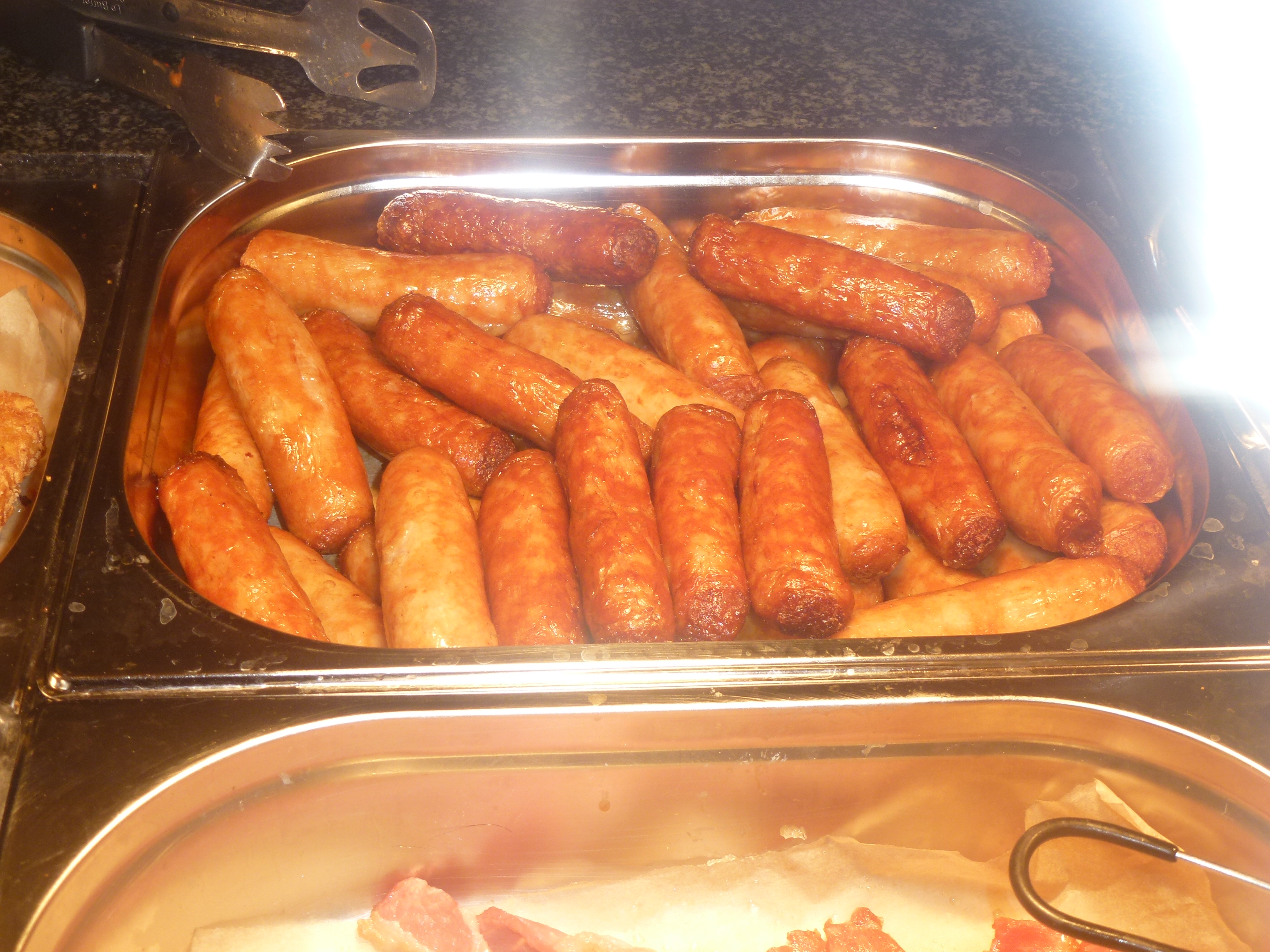 cooked sausages in a tray